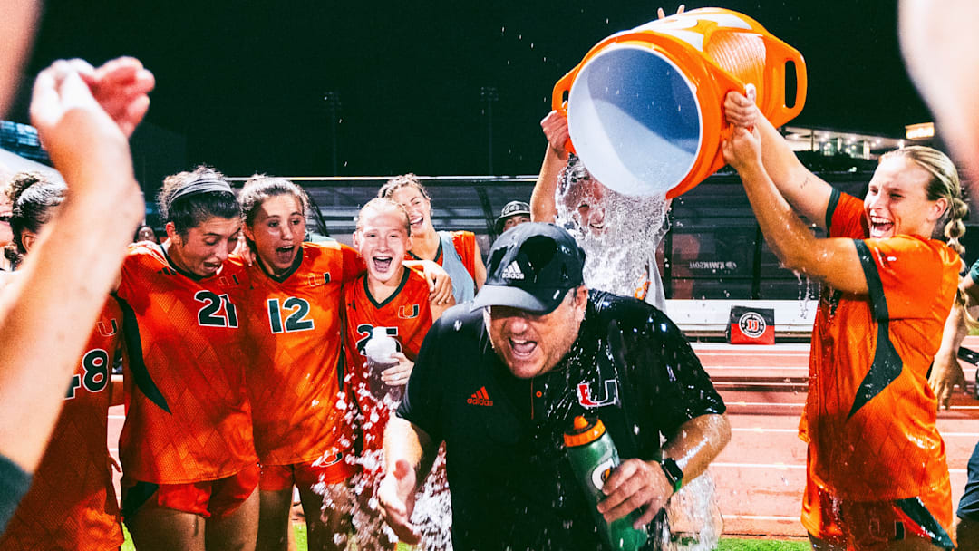 Miami soccer coach, Ken Masuhr, gets water cooler poured on him after Sunday's 1-0 win versus FIU in Cobb Stadium in Coral Gables, Florida. Mandatory Credit: @MiamiHurricanes on X