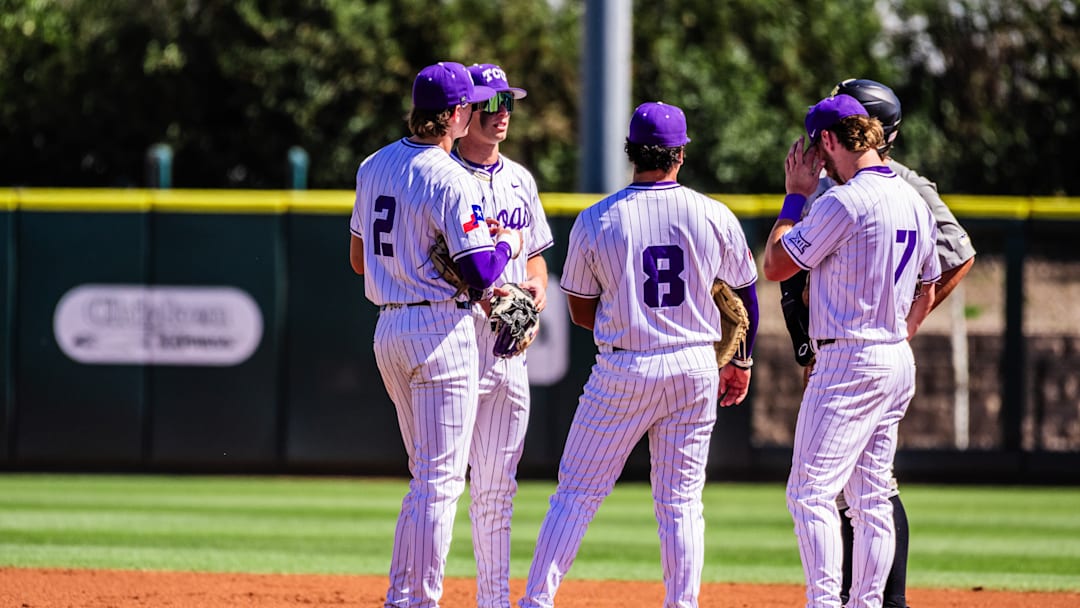 March 1, 2025-TCU Baseball players gather with a Southern Miss base runner at Lupton Stadium.