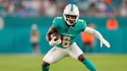 Aug 23, 2025; Miami Gardens, Florida, USA; Miami Dolphins wide receiver Malik Washington (6) runs with the football against the Jacksonville Jaguars during the second quarter at Hard Rock Stadium. 