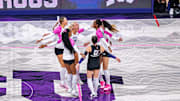 TCU Volleyball players celebrate four consecutive points in set two against Cincinnati.