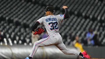 Sep 16, 2025; Denver, Colorado, USA; Miami Marlins pitcher Ronny Henriquez (32) delivers a pitch in the ninth inning against the Colorado Rockies at Coors Field. 