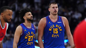Apr 19, 2025; Denver, Colorado, USA; Denver Nuggets center Nikola Jokic (15) and Denver Nuggets guard Jamal Murray (27) during overtime against the LA Clippers at Ball Arena. Mandatory Credit: Ron Chenoy-Imagn Images