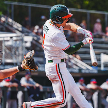 Miami's shortstop Jake Ogden smashing a homerun against UConn