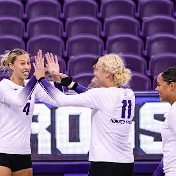 Becca Kelley, Sarah Sylvester and Jalyn Gibson celebrate a point scored in TCU Volleyball's win over Prairie View A&M on September 12, 2024. 