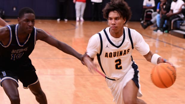 St. Thomas guard DJ Sandi (2) drives to the basket during the title game of the 51st annual Kingdom of the Sun Tournament.