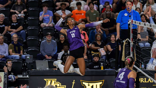 TCU Volleyball's Evan Hendrix (2) soars high and slams a kill in the win over UCF.