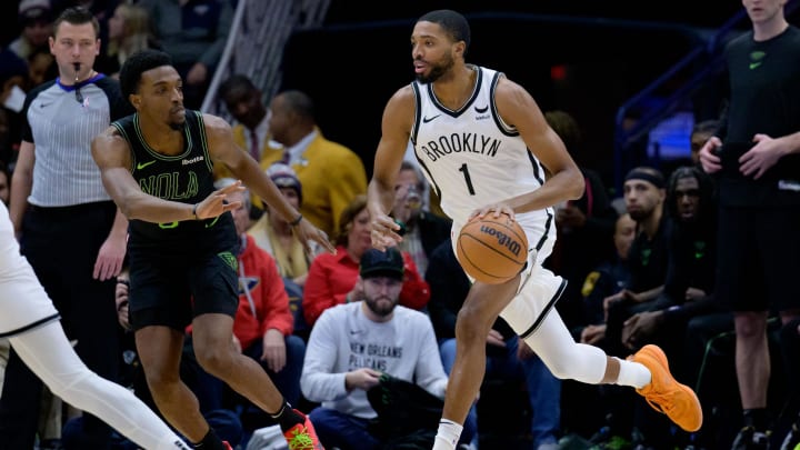 Jan 2, 2024; New Orleans, Louisiana, USA; Brooklyn Nets forward Mikal Bridges (1) dribbles against New Orleans Pelicans forward Herbert Jones (5) during the first half at Smoothie King Center. Mandatory Credit: Matthew Hinton-USA TODAY Sports