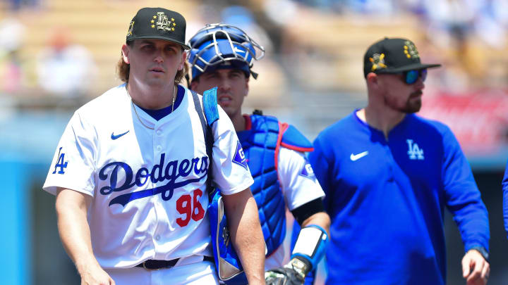 May 19, 2024; Los Angeles, California, USA; Los Angeles Dodgers pitcher Landon Knack (96) with catcher Austin Barnes (15) and bullpen coach Josh Bard before playing against the Cincinnati Reds at Dodger Stadium. Mandatory Credit: Gary A. Vasquez-USA TODAY Sports
