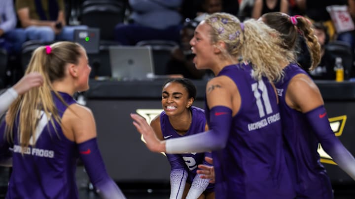 TCU Volleyball players celebrate a point scored in their win over UCF. TCU Volleyball players celebrate a point scored in their win over UCF.