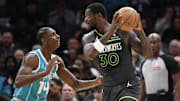 Minnesota Timberwolves forward Julius Randle controls the ball as Charlotte Hornets forward Moussa Diabate defends during the first half at the Spectrum Center in Charlotte, N.C., on March 5, 2025. 