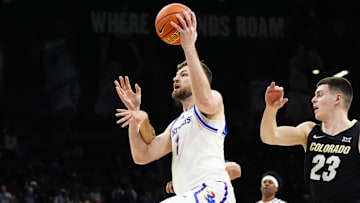 Feb 24, 2025; Boulder, Colorado, USA; Kansas Jayhawks center Hunter Dickinson (1) is fouled by Colorado Buffaloes guard Julian Hammond III (3) in the first half at the CU Events Center. Mandatory Credit: Ron Chenoy-Imagn Images
