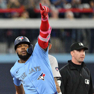 Guerrero Jr. celebrates hitting a home run against the Red Sox.