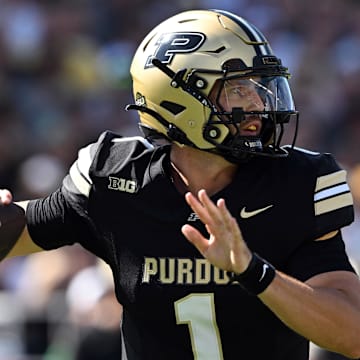 Purdue Boilermakers quarterback Hudson Card (1) throws a pass 