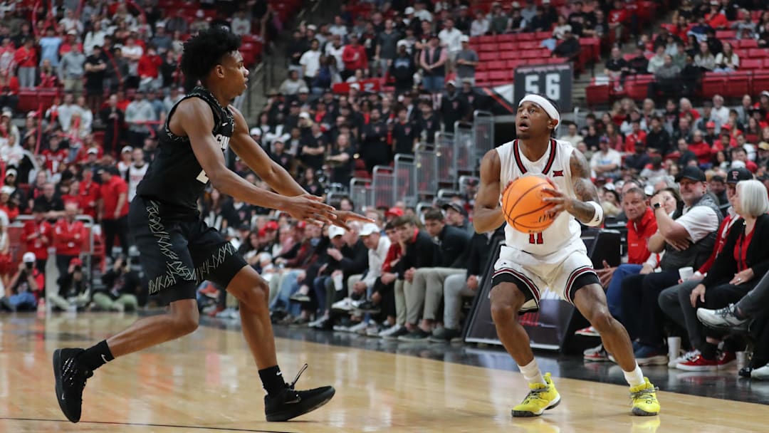 Feb 11, 2026; Lubbock, Texas, USA;  Texas Tech Red Raiders guard Jaylen Petty (11) stops to shoot against Colorado Buffaloes guard Isaiah Johnson (2) in the second half at United Supermarkets Arena. Mandatory Credit: Michael C. Johnson-Imagn Images