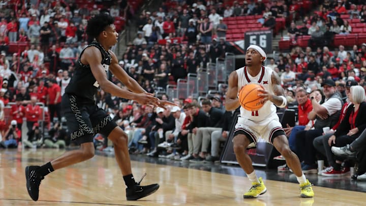 Feb 11, 2026; Lubbock, Texas, USA;  Texas Tech Red Raiders guard Jaylen Petty (11) stops to shoot against Colorado Buffaloes guard Isaiah Johnson (2) in the second half at United Supermarkets Arena. Mandatory Credit: Michael C. Johnson-Imagn Images