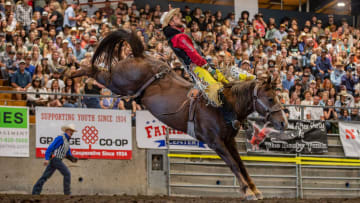R.C. Landingham riding to the win at the Wild Rogue Pro Rodeo with an 84 point ride in the bareback riding. 