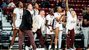 Mississippi State coaches and players celebrate a play during Monday's season-opening game against Davidson.