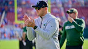 Tulane football coach Jon Sumrall encouraging his Green Wave players