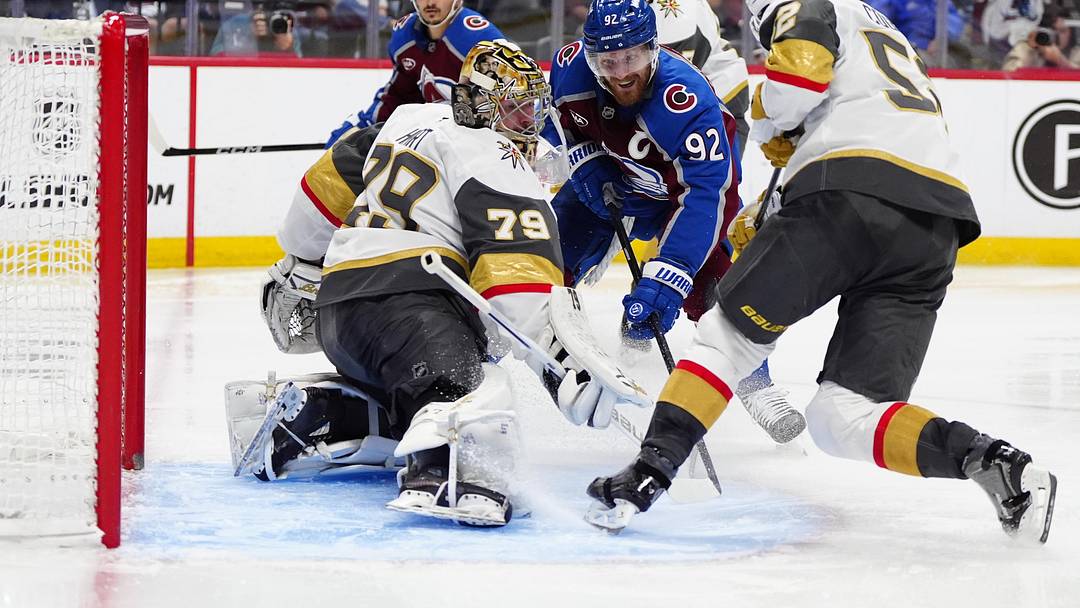 May 22, 2026; Denver, Colorado, USA; Colorado Avalanche left wing Gabriel Landeskog (92), Vegas Golden Knights defenseman Dylan Coghlan (52) and goaltender Carter Hart (79) battle for control of the puck during the second period of game two of the Western Conference Final of the 2026 Stanley Cup Playoffs at Ball Arena. Mandatory Credit: Ron Chenoy-Imagn Images May 22, 2026; Denver, Colorado, USA; Colorado Avalanche left wing Gabriel Landeskog (92), Vegas Golden Knights defenseman Dylan Coghlan (52) and goaltender Carter Hart (79) battle for control of the puck during the second period of game two of the Western Conference Final of the 2026 Stanley Cup Playoffs at Ball Arena. Mandatory Credit: Ron Chenoy-Imagn Images