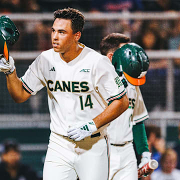 Miami Hurricanes third baseman Daniel Cuvet launches a ball out of the park for a home run against Notre Dame.