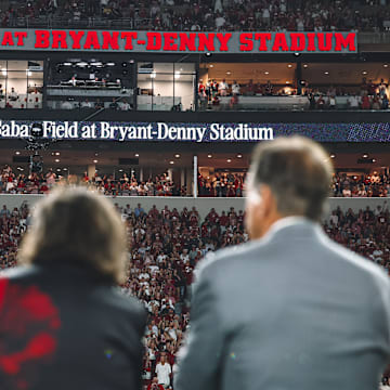 Nick Saban and his family look on at the new signage at Bryant-Denny Stadium