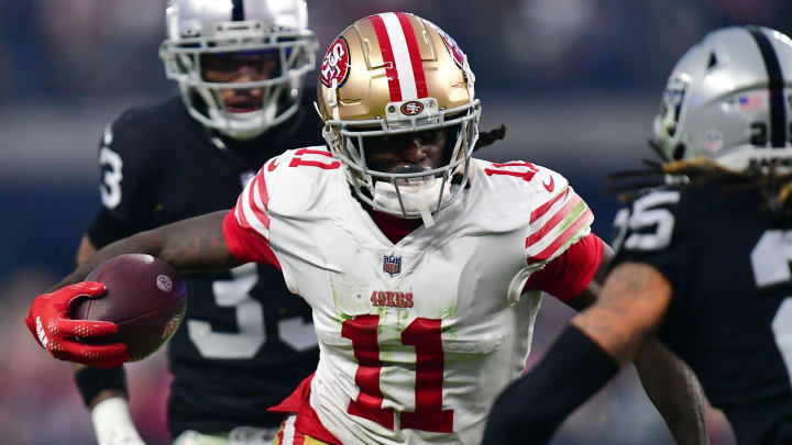 January 1, 2023; Paradise, Nevada, USA; San Francisco 49ers wide receiver Brandon Aiyuk (11) runs the ball against the Las Vegas Raiders during the second half at Allegiant Stadium. Mandatory Credit: Gary A. Vasquez-USA TODAY Sports