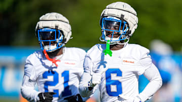 Detroit Lions cornerback Terrion Arnold (6), center, and cornerback Amik Robertson (21) practice during training camp at Meijer Performance Center in Allen Park on Tuesday, July 22, 2025.