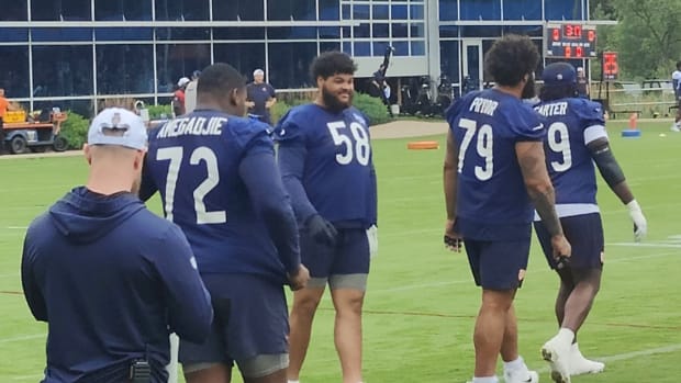 Darnell Wright (58) was back at work Tuesday for the Bears after an injury last week.