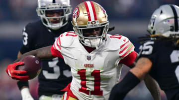 January 1, 2023; Paradise, Nevada, USA; San Francisco 49ers wide receiver Brandon Aiyuk (11) runs the ball against the Las Vegas Raiders during the second half at Allegiant Stadium. Mandatory Credit: Gary A. Vasquez-USA TODAY Sports