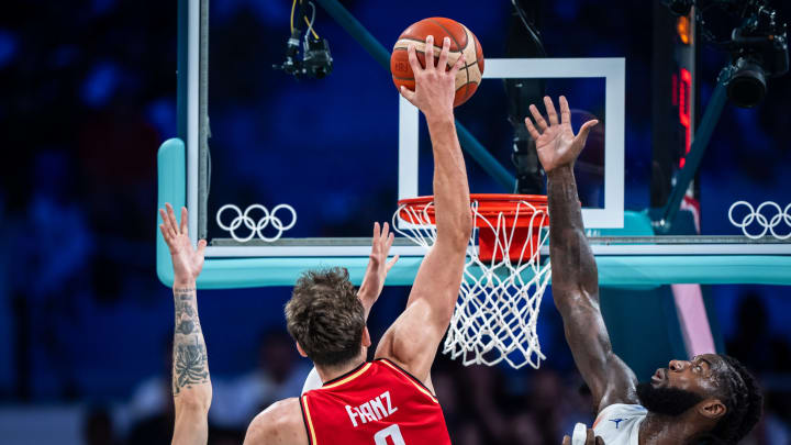 Franz Wagner dunks over multiple French defenders in Friday's Olympic Group B finale at Pierre Mauroy Stadium in France.