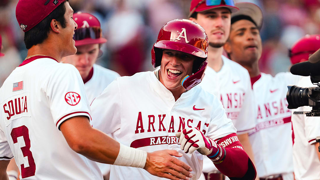 The Arkansas Razorbacks' Maika Niu celebrates a walk-off home run to run-rule Oklahoma, 12-2 in the series opener at Baum-Walker Stadium.