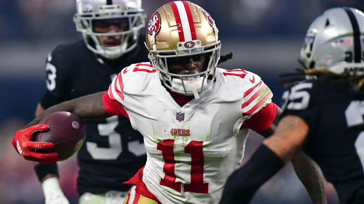 January 1, 2023; Paradise, Nevada, USA; San Francisco 49ers wide receiver Brandon Aiyuk (11) runs the ball against the Las Vegas Raiders during the second half at Allegiant Stadium.