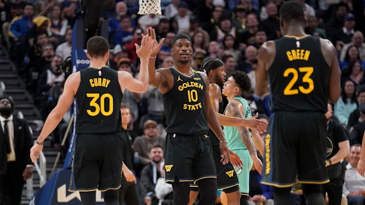 Feb 25, 2025; San Francisco, California, USA; Golden State Warriors forward Jimmy Butler III (10) is congratulated by guard Stephen Curry (30) after a basket against the Charlotte Hornets in the third quarter at the Chase Center. Mandatory Credit: Cary Edmondson-Imagn Images