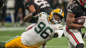 Sep 17, 2023; Atlanta, Georgia, USA; Atlanta Falcons running back Bijan Robinson (7) runs against Green Bay Packers defensive tackle Colby Wooden (96) during the second half at Mercedes-Benz Stadium. Mandatory Credit: Dale Zanine-Imagn Images