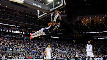 Mar 27, 2025; Newark, NJ, USA; Arizona Wildcats guard Caleb Love (1) dunks the ball during the second half against the Duke Blue Devils during an East Regional semifinal of the 2025 NCAA tournament at Prudential Center. Mandatory Credit: Vincent Carchietta-Imagn Images