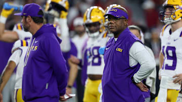 Louisiana State Tigers interim head coach Frank Wilson looks on during warmups prior to the game against the Alabama Crimson Tide at Saban Field at Bryant-Denny Stadium. 