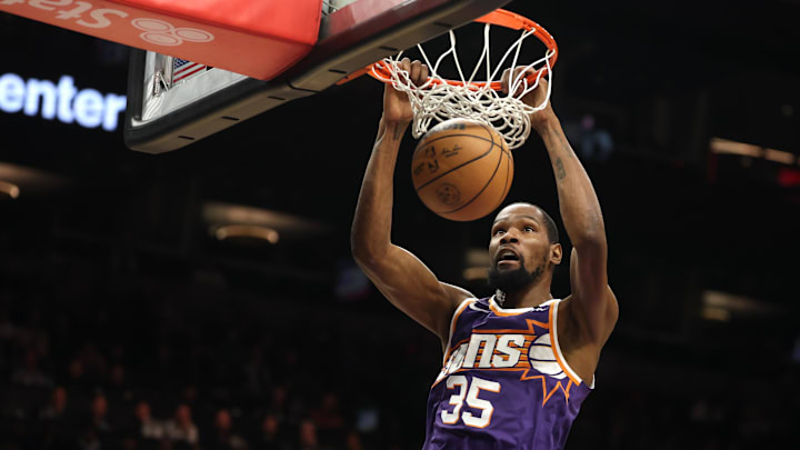Jan 9, 2025; Phoenix, Arizona, USA; Phoenix Suns forward Kevin Durant (35) slam dunks the ball against the Atlanta Hawks in the first half at Footprint Center. Mandatory Credit: Mark J. Rebilas-Imagn Images