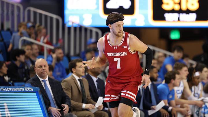 Jan 21, 2025; Los Angeles, California, USA;  Wisconsin Badgers forward Carter Gilmore (7) reacts after making a three-point basket during the first half against the UCLA Bruins at Pauley Pavilion presented by Wescom. Mandatory Credit: Kiyoshi Mio-Imagn Images