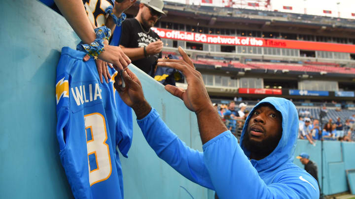 Sep 17, 2023; Nashville, Tennessee, USA; Los Angeles Chargers wide receiver Mike Williams (81) signs a jersey before the game against the Tennessee Titans at Nissan Stadium. Mandatory Credit: Christopher Hanewinckel-USA TODAY Sports