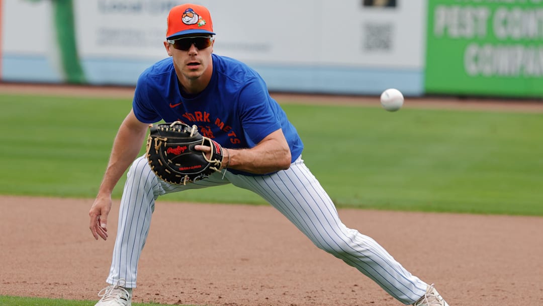 Feb 17, 2026; Port St. Lucie, FL, USA;  New York Mets infielder Jared Young (29) fields a ground ball hopper during the New York Mets spring training workouts at Clover Park. Mandatory Credit: Reinhold Matay-Imagn Images