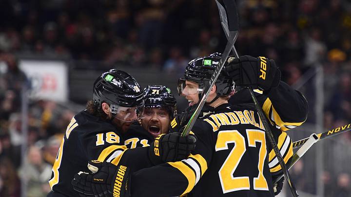 Mar 10, 2026; Boston, Massachusetts, USA; Boston Bruins center Pavel Zacha (18) left wing Viktor Arvidsson (71) defenseman Hampus Lindholm (27) celebrate a goal by defenseman Mason Lohrei (6) during the third period against the Los Angeles Kings at TD Garden. Mandatory Credit: Bob DeChiara-Imagn Images