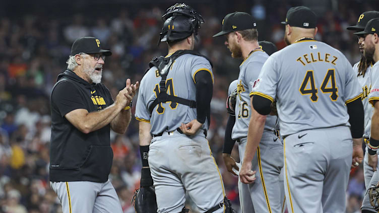 Jul 30, 2024; Houston, Texas, USA; Pittsburgh Pirates manager Derek Shelton (17) takes the ball from starting pitcher Bailey Falter (26) during a pitching change in the sixth inning against the Houston Astros at Minute Maid Park. Mandatory Credit: Troy Taormina-USA TODAY Sports