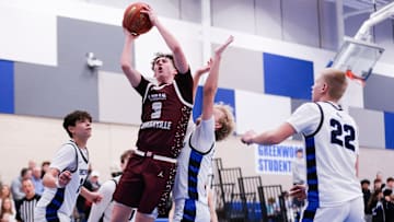 Logan-Rogersville guard Chase Branham creates contact before a layup attempt during the Wildcats' win over Greenwood on Feb. 13, 2025.