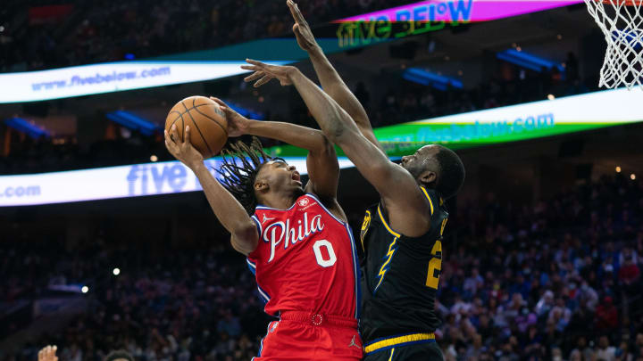 Dec 11, 2021; Philadelphia, Pennsylvania, USA; Philadelphia 76ers guard Tyrese Maxey (0) drives for a shot against Golden State Warriors forward Draymond Green (23) during the fourth quarter at Wells Fargo Center. Mandatory Credit: Bill Streicher-USA TODAY Sports