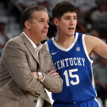 Feb 27, 2024; Starkville, Mississippi, USA; Kentucky Wildcats guard Reed Sheppard (15) talks with head coach John Calipari (left) during the second half against the Mississippi State Bulldogs at Humphrey Coliseum. Mandatory Credit: Petre Thomas-USA TODAY Sports