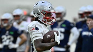 May 9, 2025; Foxborough, MA, USA; New England Patriots wide receiver Kyle Williams (18) runs with the ball during rookie camp at Gillette Stadium. Mandatory Credit: Eric Canha-Imagn Images