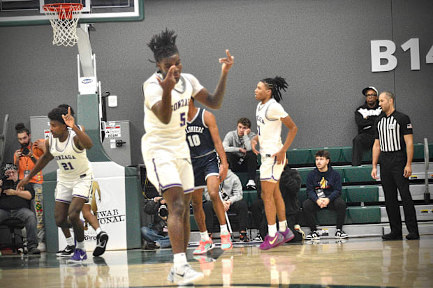 La Lumiere's Nyk Lewis celebrates a 3-pointer in the Les Schwab Invitational championship in Portland, Oregon. 