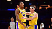 January 15, 2025; Los Angeles, California, USA; Los Angeles Lakers forward Rui Hachimura (28) reacts with guard Austin Reaves (15) after scoring a basket and drawing the foul against the Miami Heat during the second half at Crypto.com Arena. Mandatory Credit: Gary A. Vasquez-Imagn Images