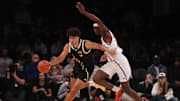 Apr 1, 2025; Brooklyn, NY, USA; McDonald's All American East forward Cameron Boozer (12) dribbles the ball against McDonald's All American West forward AJ Dybantsa (3) during the second half of the game at Barclays Center. Mandatory Credit: Pamela Smith-Imagn Images