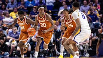 Feb 1, 2025; Baton Rouge, Louisiana, USA;  Texas Longhorns guard Tre Johnson (20) brings the ball up court against LSU Tigers forward Robert Miller III (6) during the second half at Pete Maravich Assembly Center. Mandatory Credit: Stephen Lew-Imagn Images
